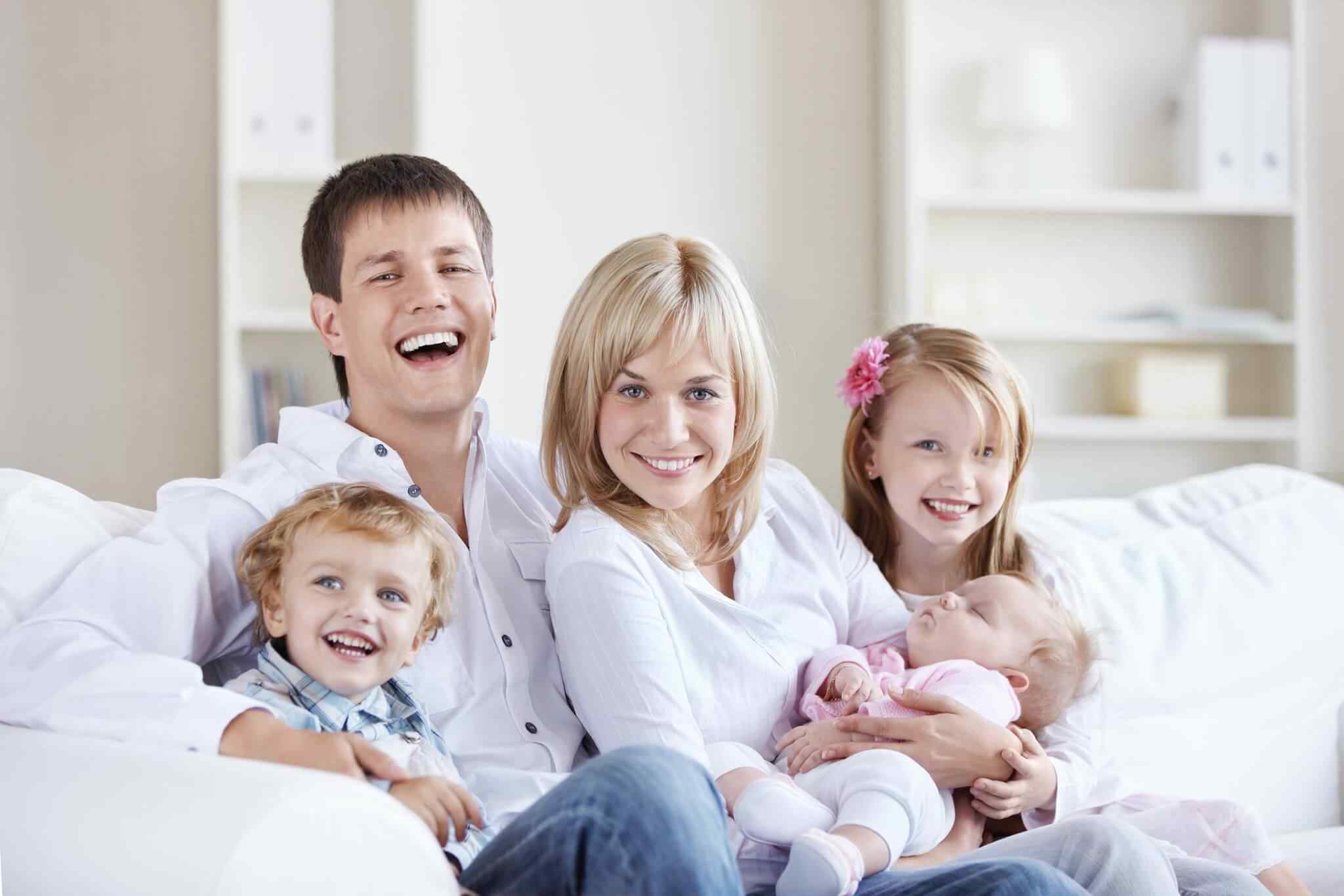 A happy family with three children at home